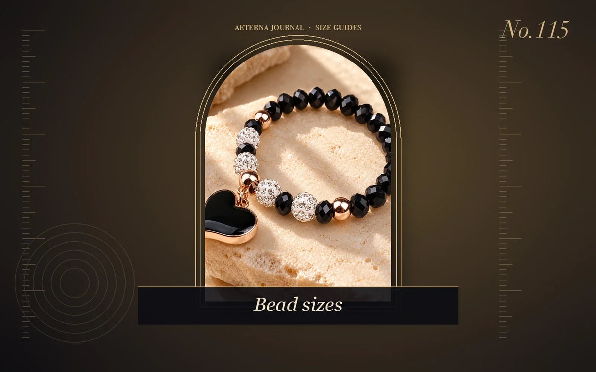 Black faceted bead bracelet with a black enamel heart charm
