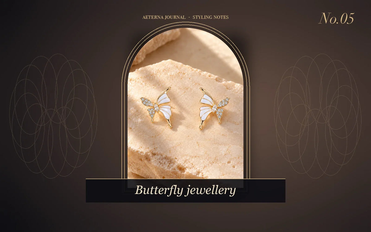 Pair of rhinestone butterfly stud earrings with enamel wings