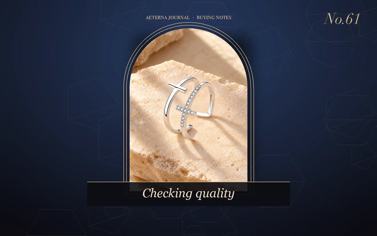 Close-up of a double-cross ring set with small zircon stones