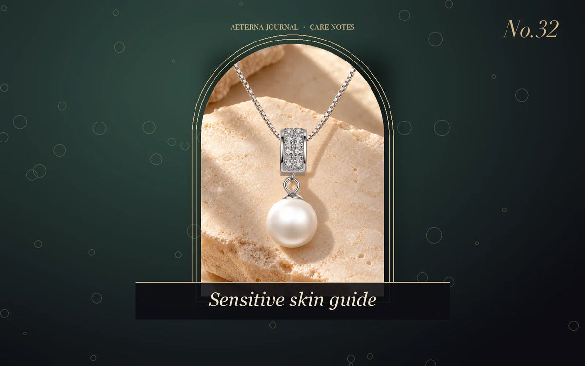 Pearl pendant on a fine silver chain on a light background