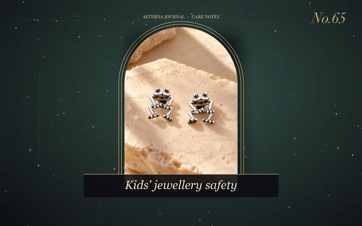 Pair of small silver-tone frog stud earrings