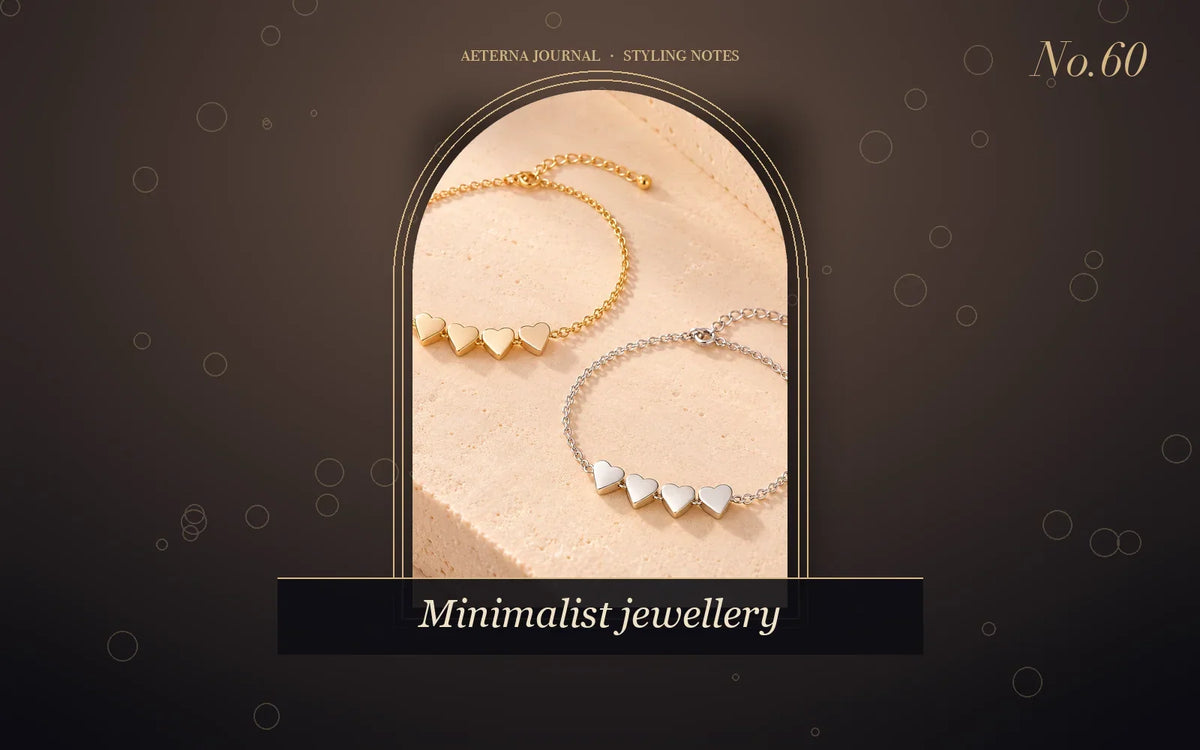 Two fine chain bracelets with small heart links in gold and silver tones