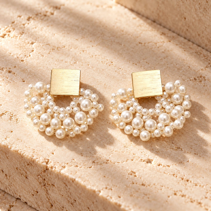 Generated concept artwork for Handmade Pearl Woven Scalloped Pearl Earrings; illustrative only, not an exact product photograph